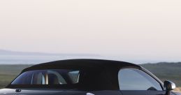 Sleek convertible sports car with a stylish design, parked against a scenic background for performance testing.