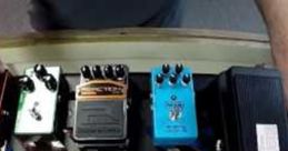 Colorful basic effect pedals arranged on a board, showcasing a variety of sound modulation options for musicians.