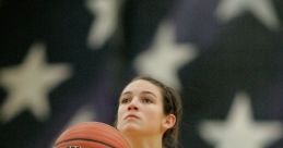 WDHS Basketball player prepares to shoot, focused on the hoop, wearing jersey number 10 and holding a Wilson ball.