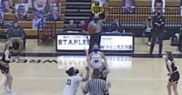 Girls basketball game tipping off at Staples High School, February 26, 2021, with players and referee on court.