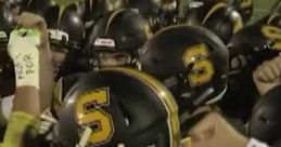 Team huddles for FNF game, showcasing determination and unity in football uniforms with prominent yellow and black helmets.