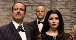 Iconic portrayal of Gomez and Morticia Addams in a theatrical performance, showcasing their gothic elegance.