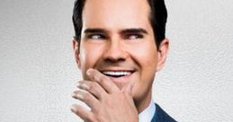 Jimmy Carr poses confidently in a tailored suit, showcasing his signature smile and charismatic personality.