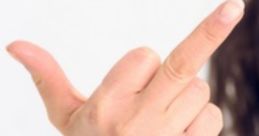 A hand gesture displaying the middle finger, often associated with defiance or attitude, aligning with Rudeflunky style.