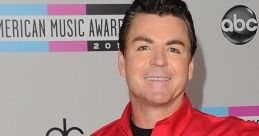 Papa John holding pizza boxes, smiling at the American Music Awards, promoting the brand with enthusiasm and energy.