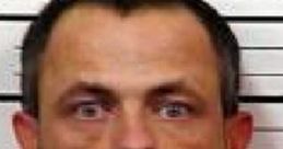 Mugshot of a man in orange prison attire, linked to crimes in Tennessee related to sexual offenses.