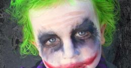 Child dressed as Da Joker Baby, featuring vibrant green hair, clown makeup, and a stylish outfit with a flower accessory.