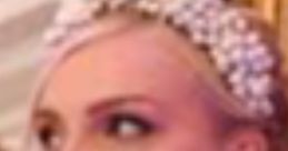 Elegant debutante showcasing a sophisticated hairstyle adorned with a pearl headpiece and sparkling earrings.