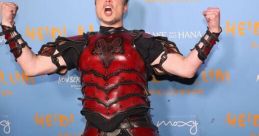 Elon Musk celebrating Halloween in a bold red and black armor costume at Heidi Klum's annual party event.