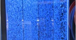 Blue illuminated water wall feature, creating a calming ambiance for indoor spaces. Perfect for modern interior design.