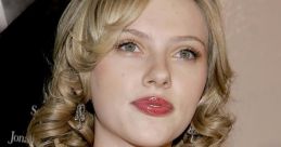 Scarlett Johansson at a red carpet event, showcasing her glamorous look with elegant curls and a stunning dress.