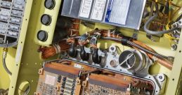 Close-up of missile guidance system components, showcasing intricate circuit boards and wiring connections for precision targeting.