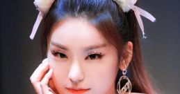 Yeji from ITZY showcases her unique style with cat ear accessories and stunning makeup, exuding confidence and charisma.