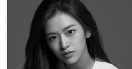 Yujin from IVE showcasing her beauty in a monochrome portrait, exuding elegance and charisma.