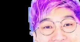 Justin from LankyBox smiling widely, showcasing his vibrant personality and signature purple hairstyle, wearing glasses.