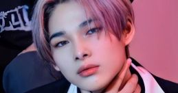 Ni-ki from ENHYPEN showcases a stylish look with pastel hair and a confident pose, capturing K-pop's vibrant culture.