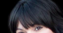 Portrait of a woman with dark hair and soft makeup, smiling and showcasing warmth and approachability. Ideal for music inspiration.
