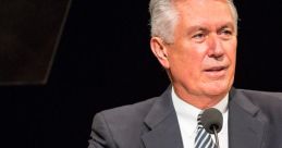Dieter F. Uchtdorf speaks at a podium, sharing insights and guidance during a Church of Jesus Christ event.