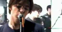Drake Bell performing in a band setting, showcasing his music style reminiscent of the "Drake and Josh" theme song.