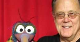 David Goelz alongside Gonzo, the iconic Muppet, showcasing their playful bond and colorful outfits.