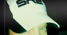 Seth Green wearing an SR2 hat, portraying Joker from Mass Effect 3, showcasing a playful and confident expression.