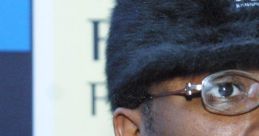 Ol' Dirty Bastard wearing a distinctive fur hat, showcasing his unique style and personality as a pioneering rapper.