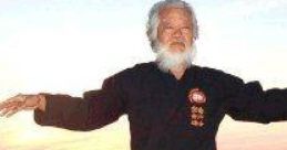 Elderly martial artist practicing Tai Chi at sunset, showcasing balance and harmony in nature.