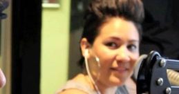 Sheen Estevez smiling while speaking on air at 101.1 The Beat, showcasing her engaging personality and style.