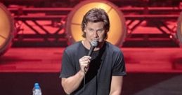 Theo Von delivering a stand-up comedy routine on stage, showcasing his unique style and engaging performance.