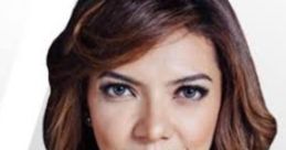 Najwa Shihab, Indonesian journalist, showcasing thoughtful expression with hands clasped, in a professional setting.