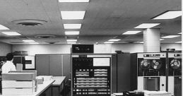 Historic IBM 7094 computer setup featuring data processors and peripherals in a vintage computing environment.