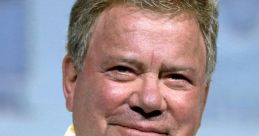 William Shatner smiles at a public event, showcasing his iconic presence as a legendary actor and pop culture icon.