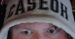 Person with a beard wearing a hoodie labeled "CASEOH," focused and ready for an online streaming session.