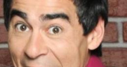 Amador Rivas Latorre from "La Que Se Avecina" with an excited expression in a vibrant pink shirt. Versión MEJORADA.