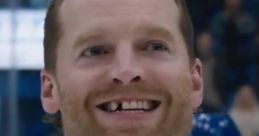 Smiling hockey player with a missing tooth, showcasing the fun and camaraderie of the Shoresy prank on the ice.