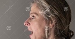 Woman shouting profanities in a passionate expression, showcasing strong emotions and frustration in a minimalist setting.