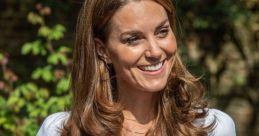 Kate Middleton smiles brightly while holding glasses, wearing a chic white top and pink trousers in a lush garden setting.