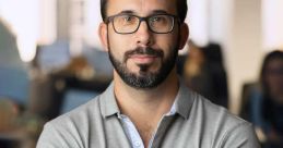 Professional portrait of Alejandro Astacio Sánchez in an office setting, showcasing confidence and leadership skills.