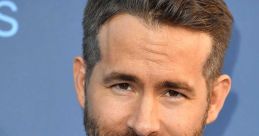 Ryan Reynolds in a classic tuxedo with a bowtie, showcasing his charming smile and stylish look at a red carpet event.