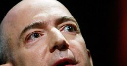 Jeff Bezos speaking passionately at a conference, showcasing his visionary leadership and innovation in technology.