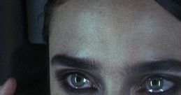 Emotional close-up of a distressed woman on the phone, capturing the intense themes of despair in "Requiem for a Dream.