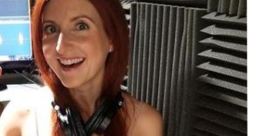 Tilly Green (Marieve Herington) smiles in a recording studio, showcasing her vibrant personality and talent in voice acting.