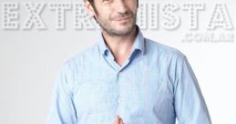 Ezequiel Rodriguez poses confidently in a blue checked shirt, showcasing a stylish and professional appearance.