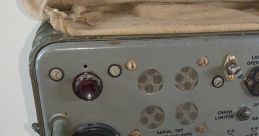 World War II radio equipment featuring tuning dials, switches, and connectors for communication purposes.