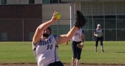 Canby Rebels Fastpitch player delivering a powerful pitch on the softball field under clear skies. Team spirit in action!