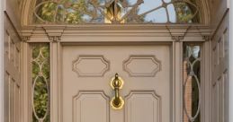 Elegant front door with intricate glass design and classic brass fixtures, showcasing beautiful architectural details.