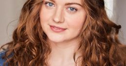 Portrait of a woman with curly hair wearing a denim jacket, showcasing a natural and approachable expression.