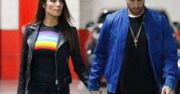 Otávio Ramos and partner walking hand in hand, showcasing trendy fashion in an urban setting.
