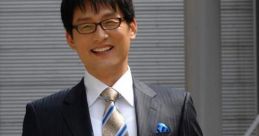 이주석, 정장 차림으로 활짝 웃으며 카메라를 바라보는 모습. 비즈니스 및 스타일 관련 이미지로 활용 가능.