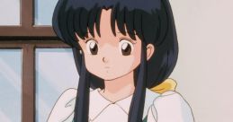 Akane Tendo from Ranma ½, wearing a teal dress and holding a bag, with a thoughtful expression by a window.